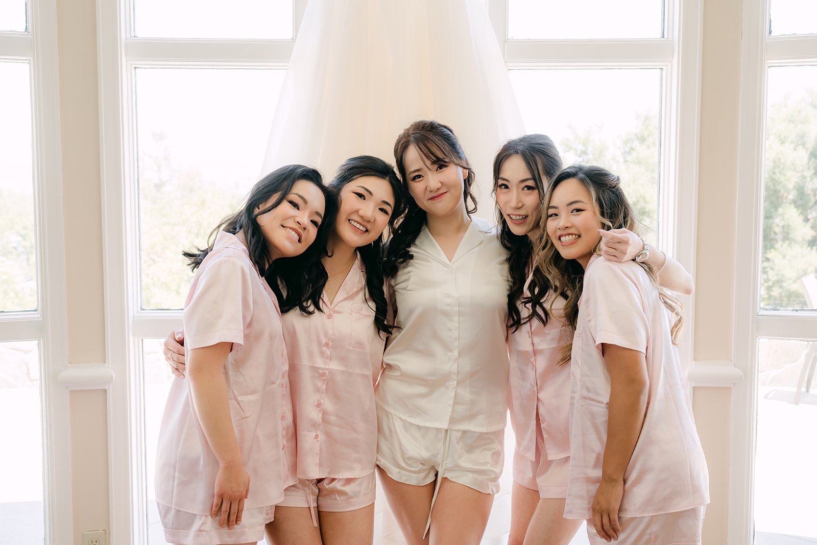 Judy hugging her bridesmaids