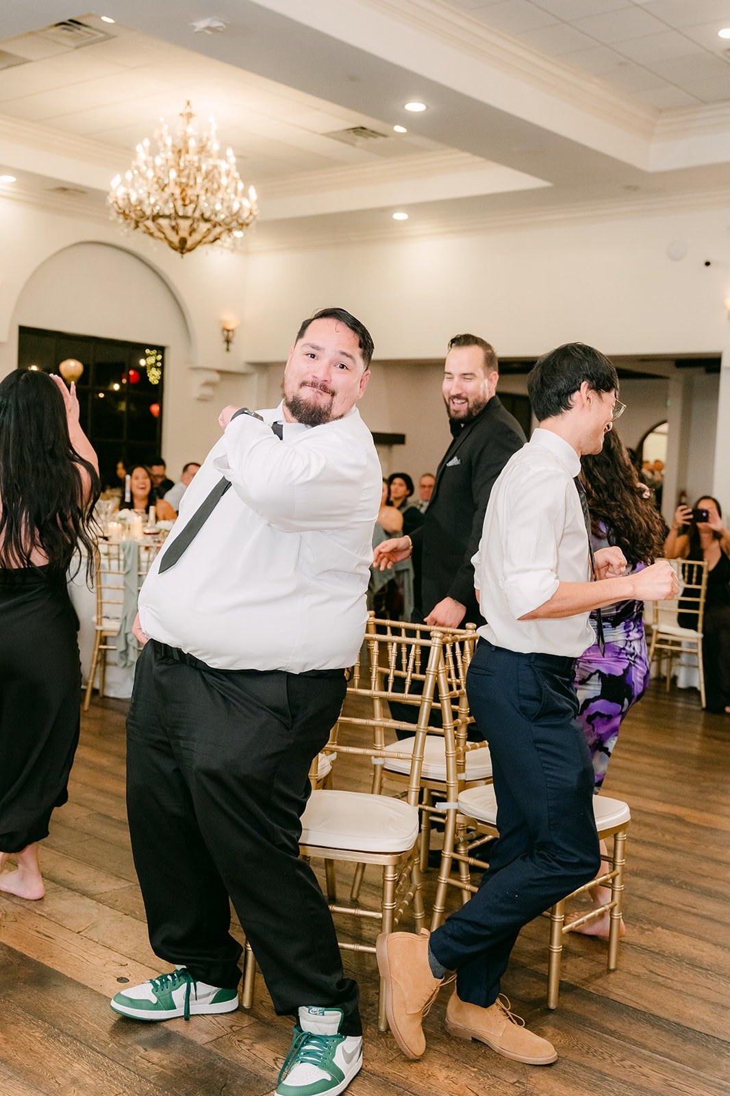 Groomsmen dancing in a reception game