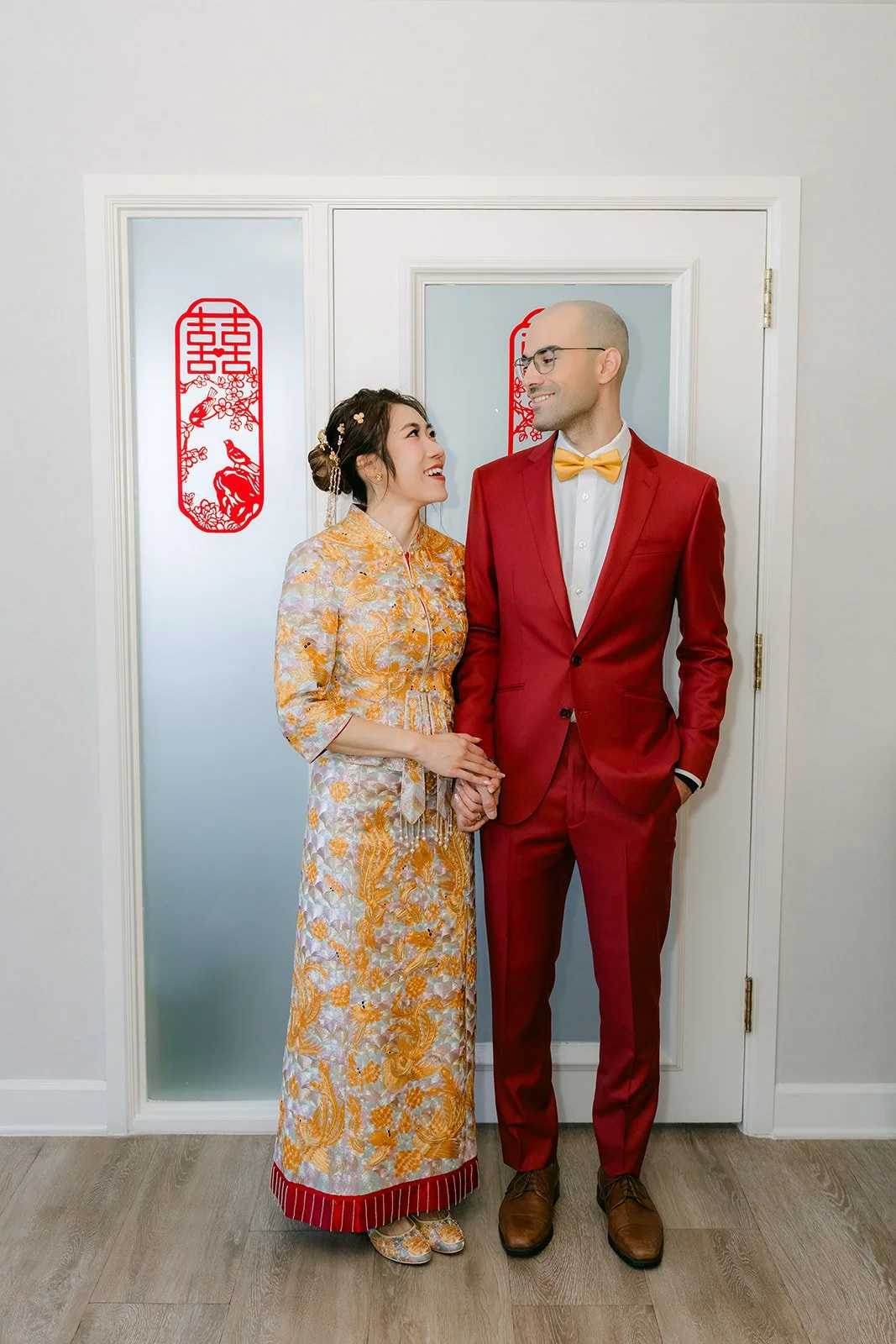 Christie and Christian posing in the doorway after the door game, photographed by One and Only Production.