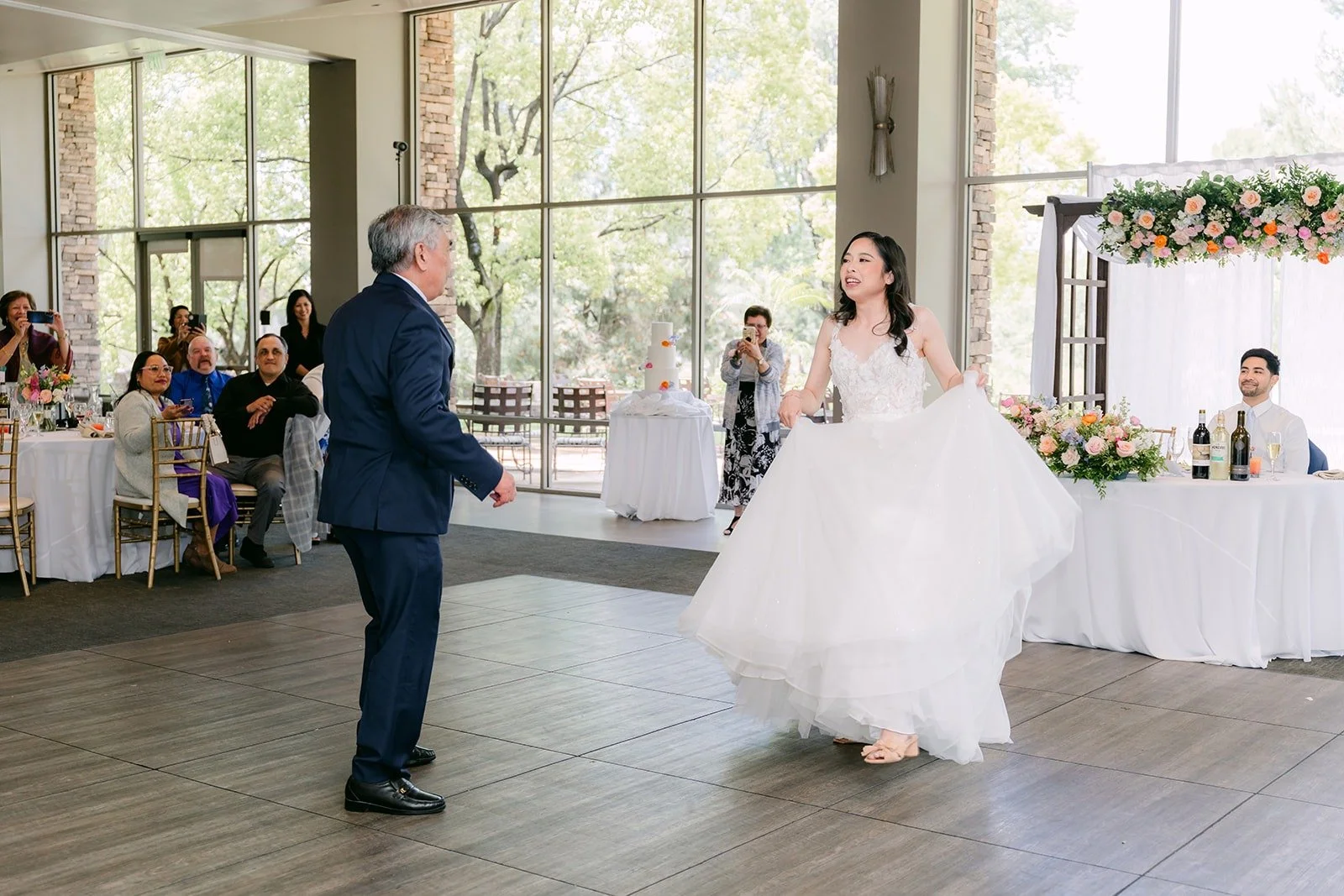 Natalie and her dad dancing across the ballroom, photographed by One and Only Production