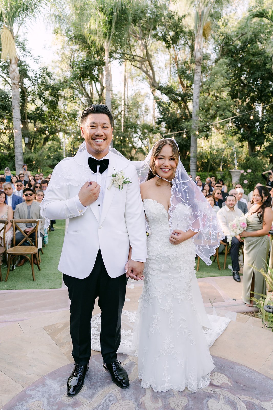 Nicole and Caryl just married in front of their guests.