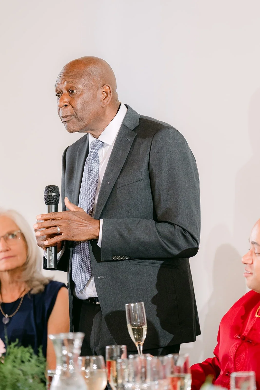 A guest gives a toast with a microphone, photographed by One and Only Production