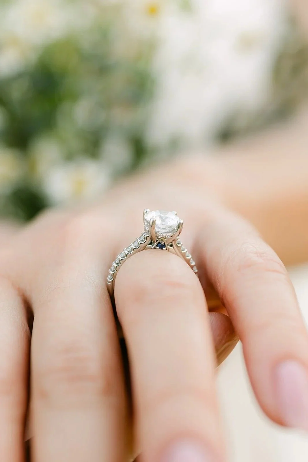 Close-up of Kim's diamond engagement ring.
