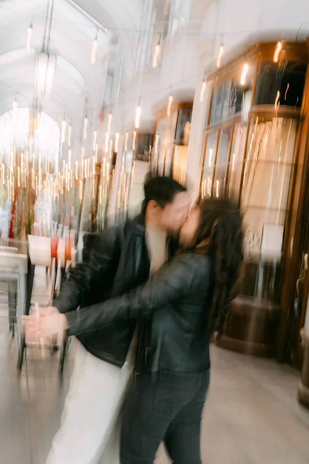 James spins Emily in a candid motion shot, photographed by One and Only Production.