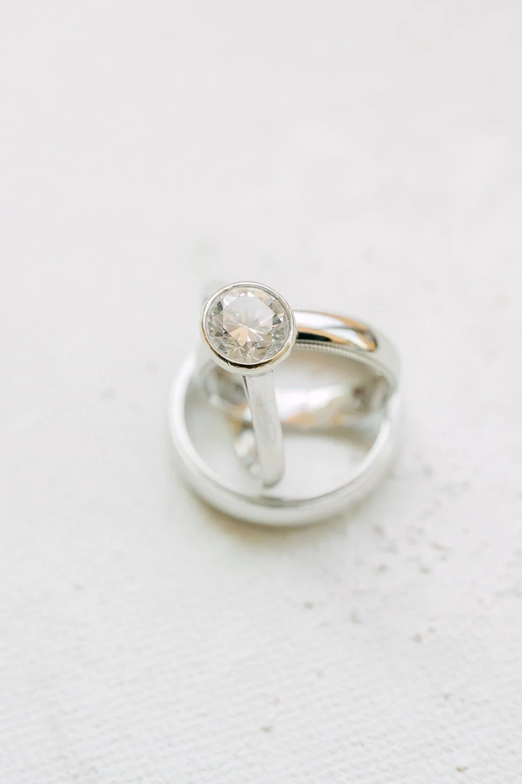 Engagement ring stacked on the two wedding bands