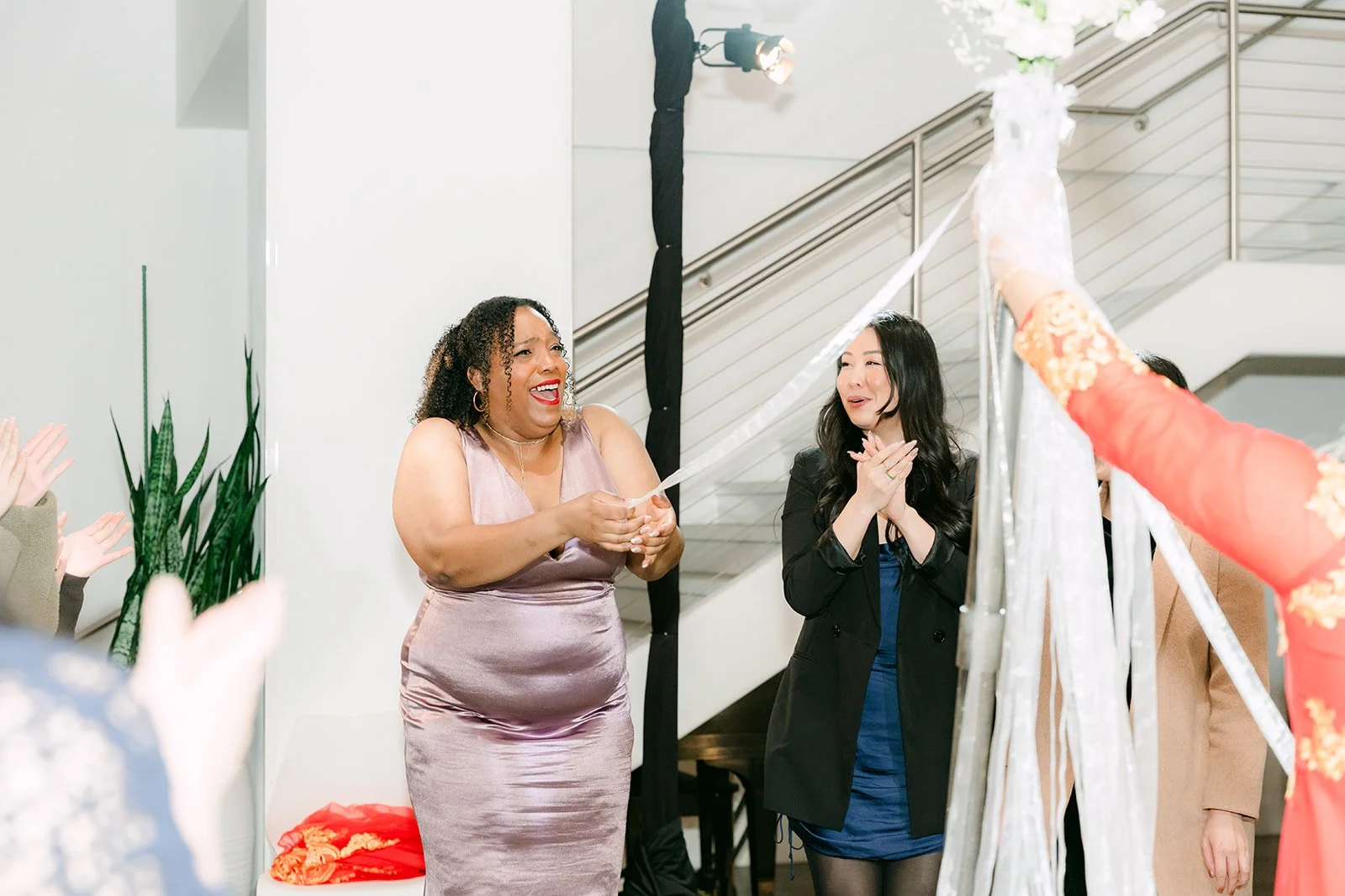 Guests reacting during the bouquet toss