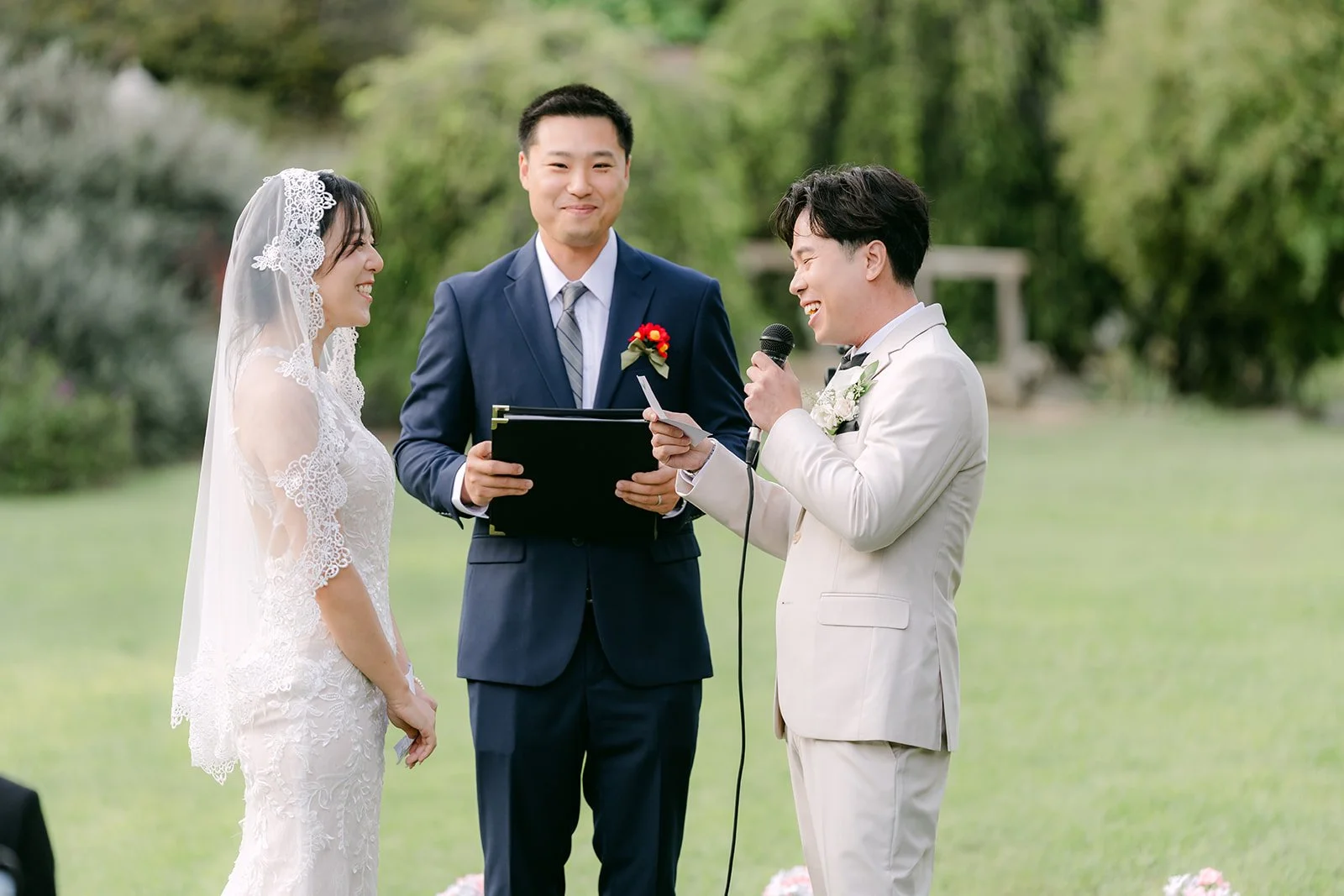 Officiant David leading the ceremony as Wen speaks.