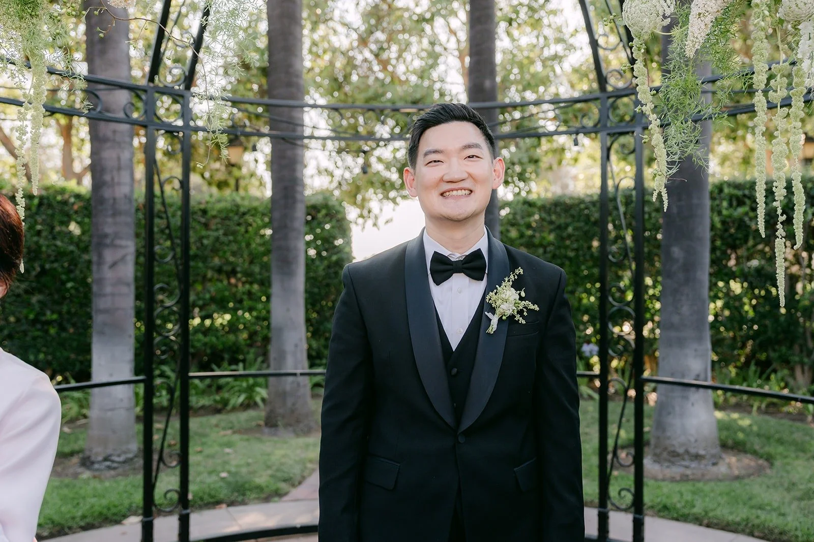 Sam waiting at the end of the aisle in the Italian Garden