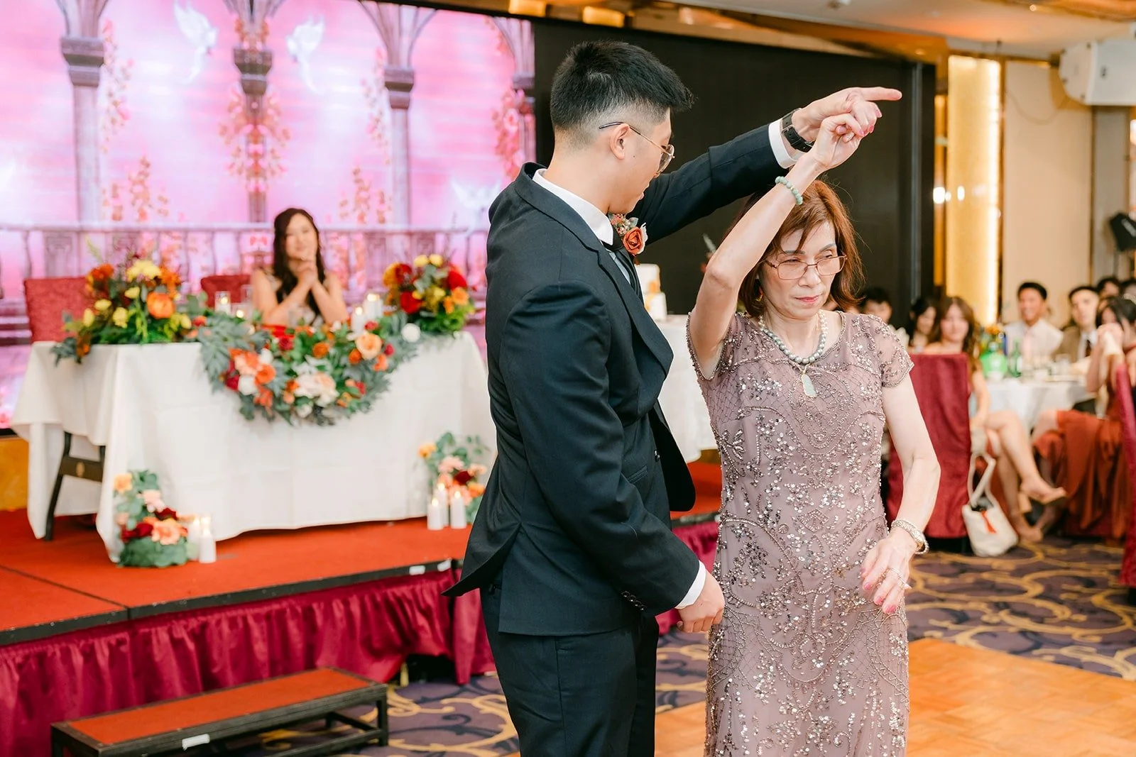 Robert dances with a parent during the parent dances
