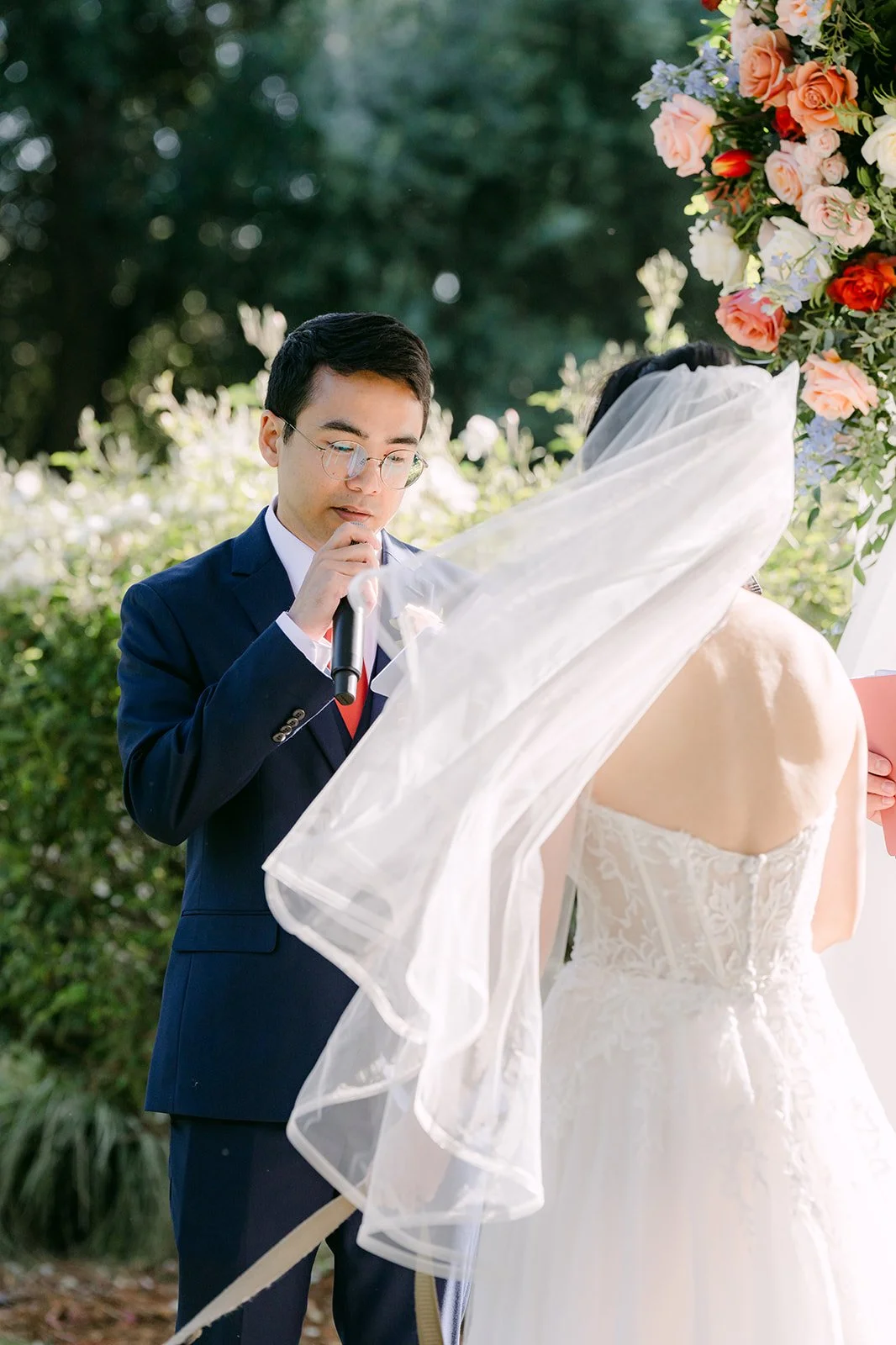 Jonathan reading his vows to Yishan at the arch
