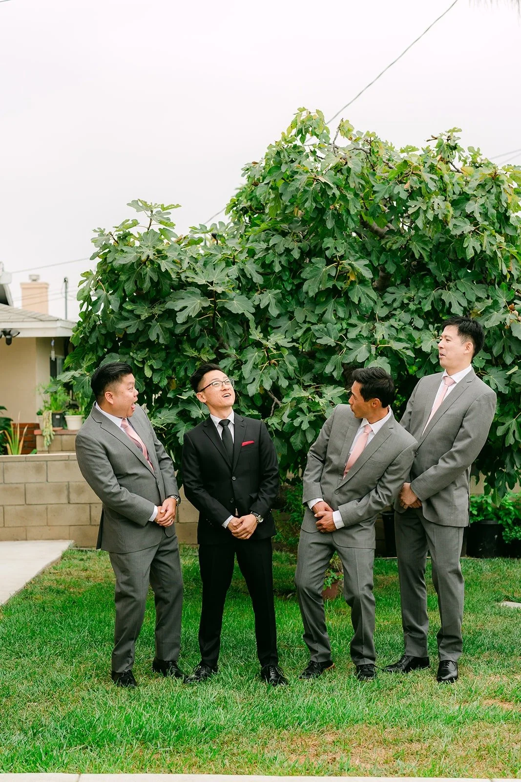 Alex and his groomsmen waiting on the front lawn before the door games