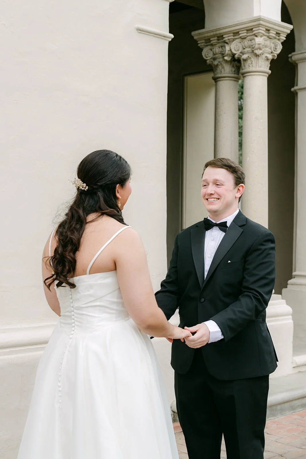 Saira and Matthew holding hands after the first look