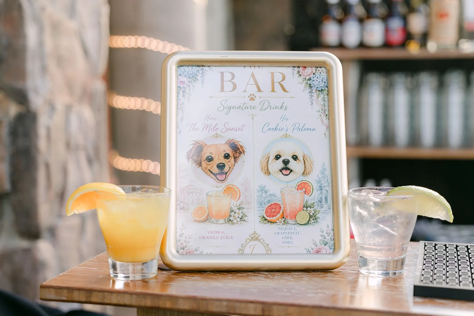 Custom bar sign featuring the couple's dogs