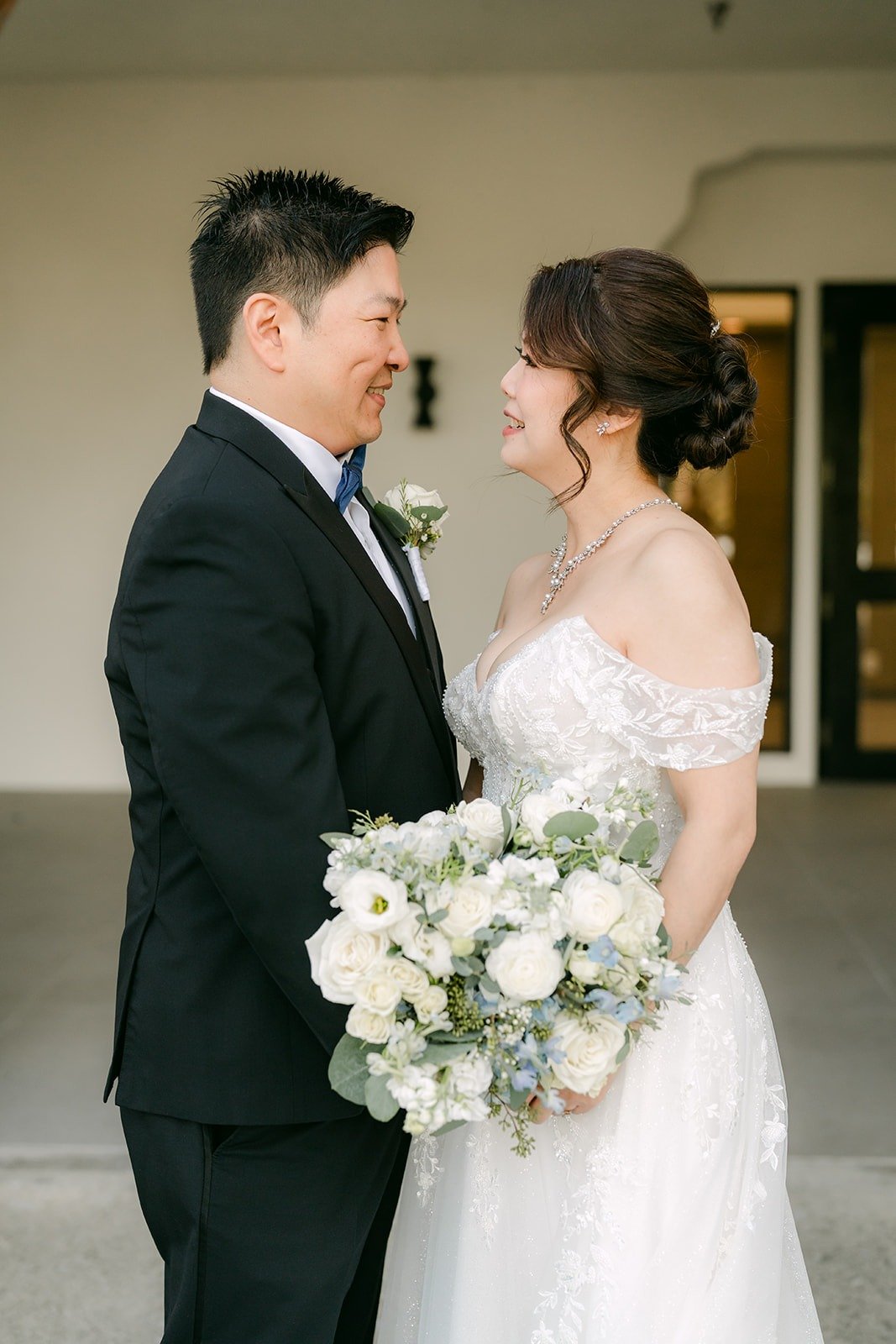 Sochi and Jay laughing together after the first look, photographed by One and Only Production