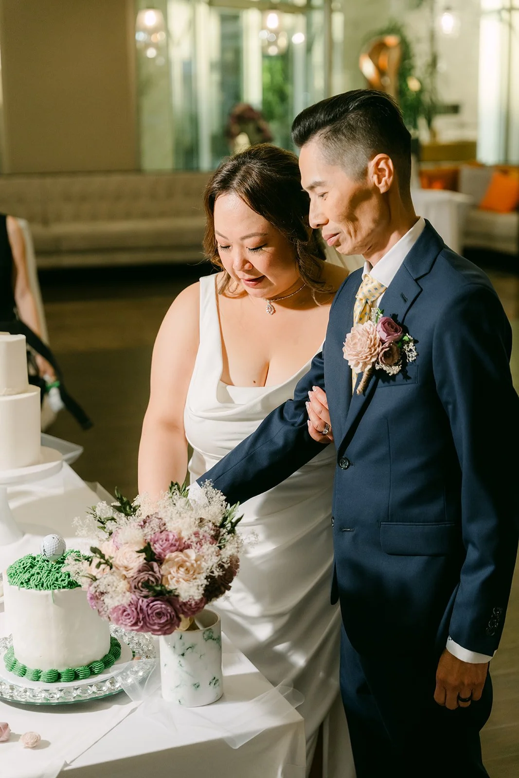 Mai and Bobby with their second cake, photographed by One and Only Production.