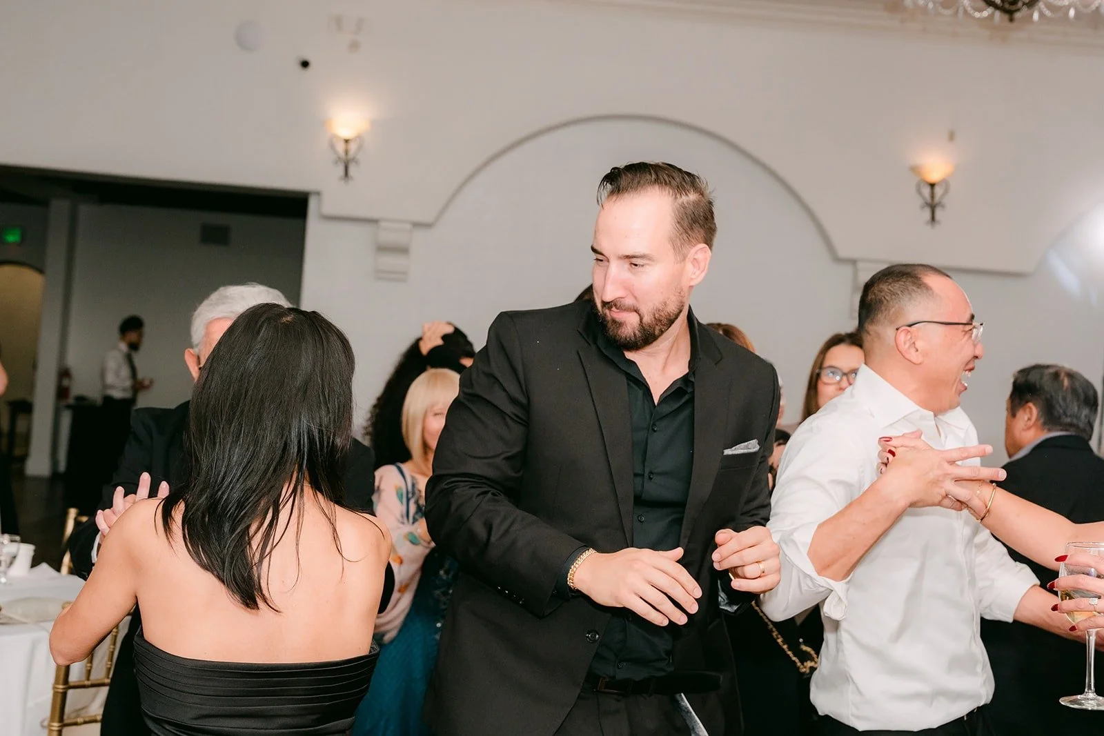 Guests dancing in the ballroom at The Villa