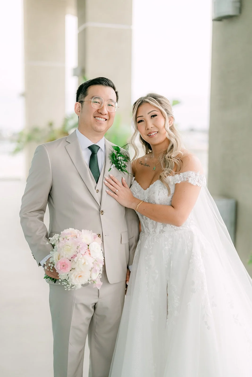 Raine and Ricky smiling together on the balcony
