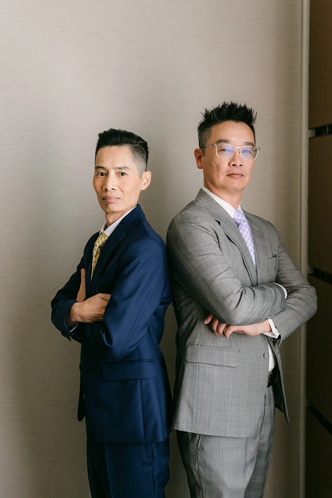 Bobby and a groomsman back to back.