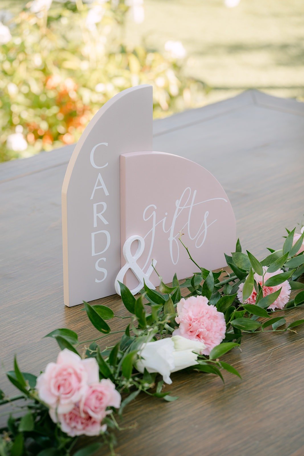 Cards and gifts sign with pink roses