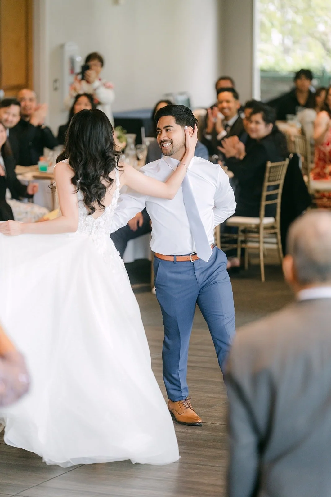 Natalie and Mark dancing as guests watch from their tables, photographed by One and Only Production