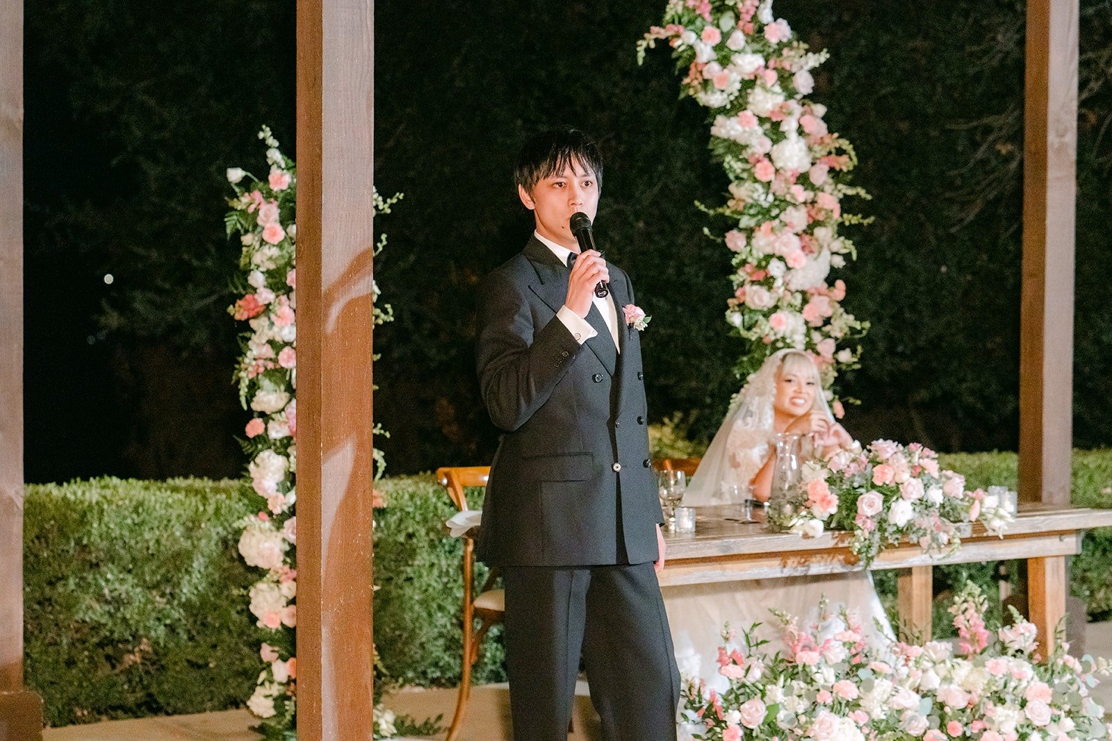 A speech under the pergola at the Bel Vino reception