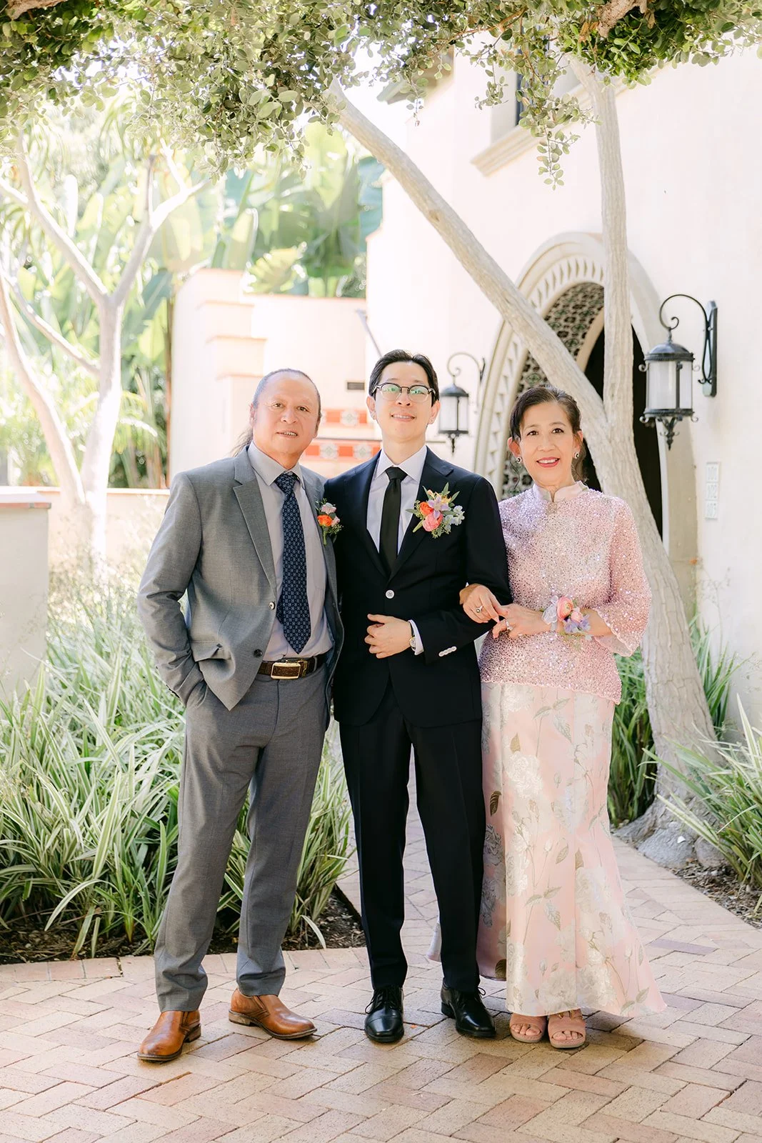 Leroy with his parents before the ceremony