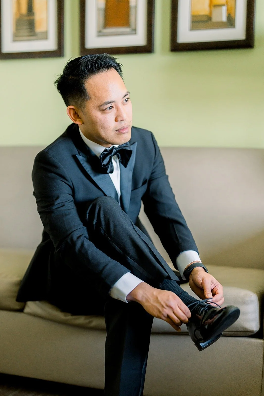 Ralph tying his shoes before the ceremony