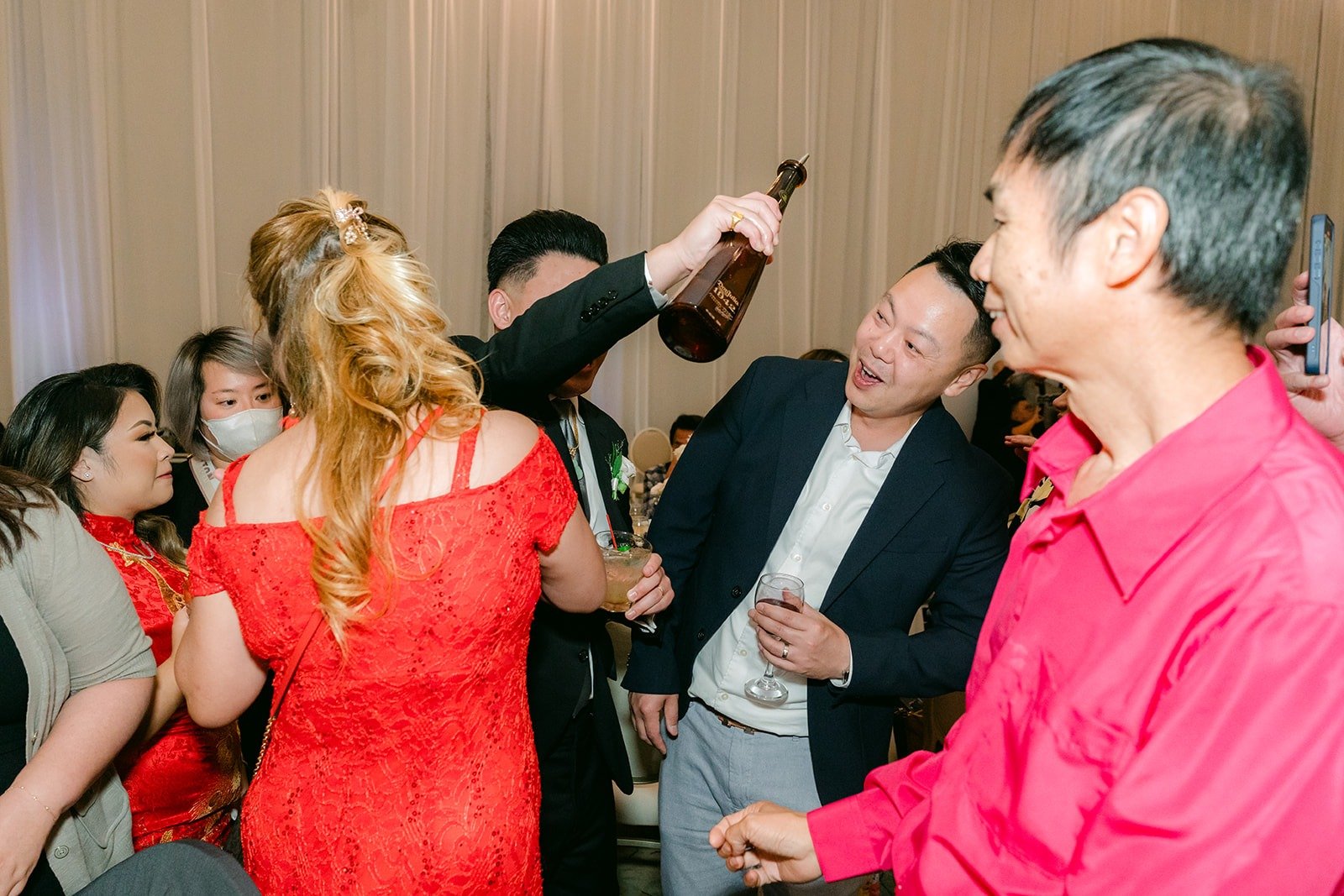 Candice and Vincent toasting with family, photographed by One and Only Production