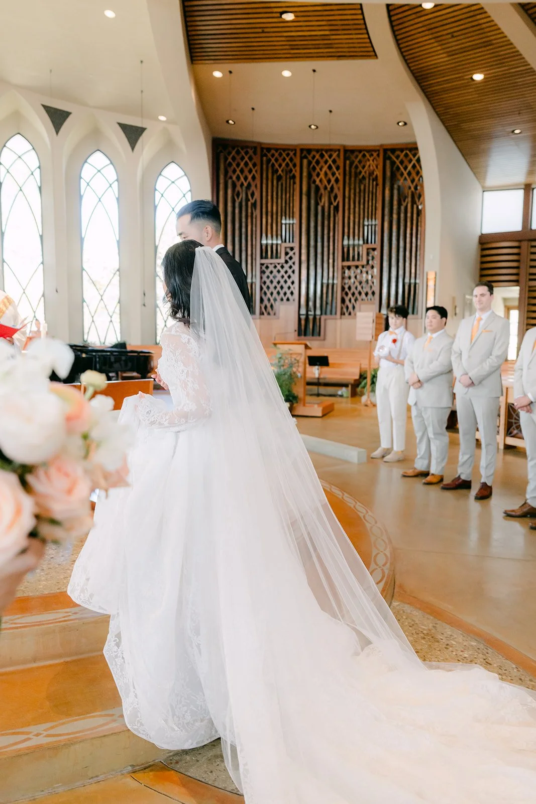 Kim's cathedral veil flowing down the aisle