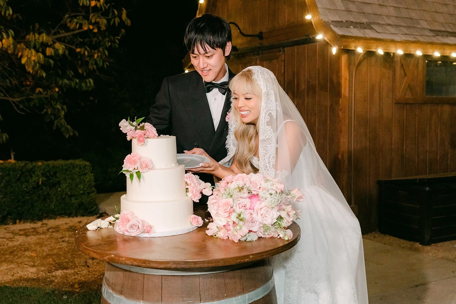 Cake cutting in front of the barn at Bel Vino Winery, photographed by One and Only Production