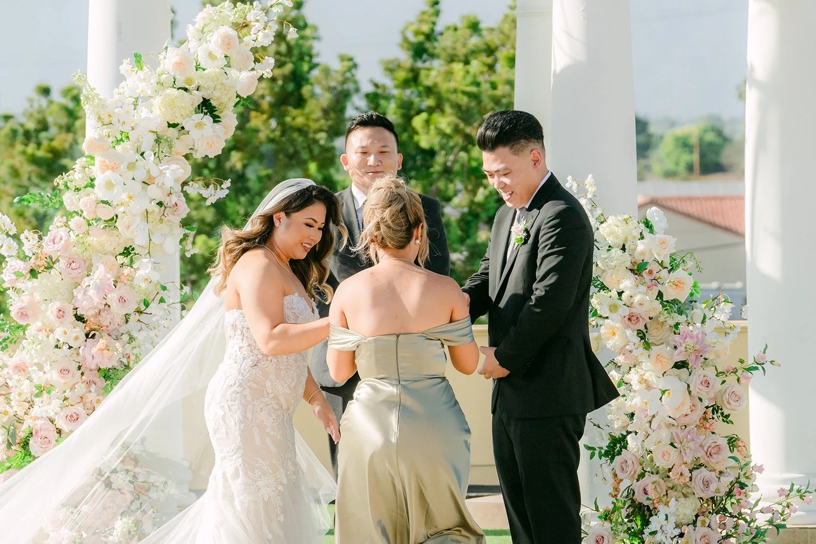 Candice and Vincent at the altar with their officiant