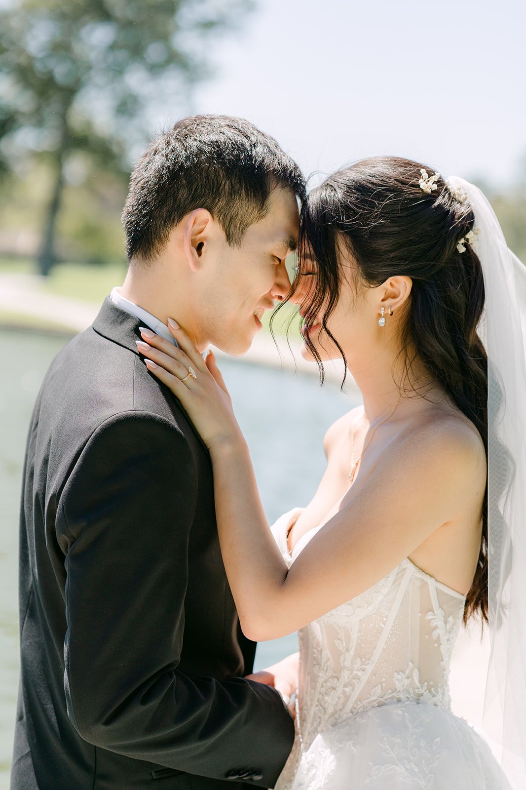 Clarissa and Austin close together with the fountain behind them