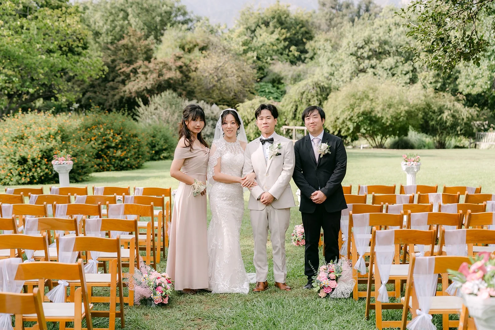 Elaine, Wen, Kathleen and Henry by the ceremony chairs.