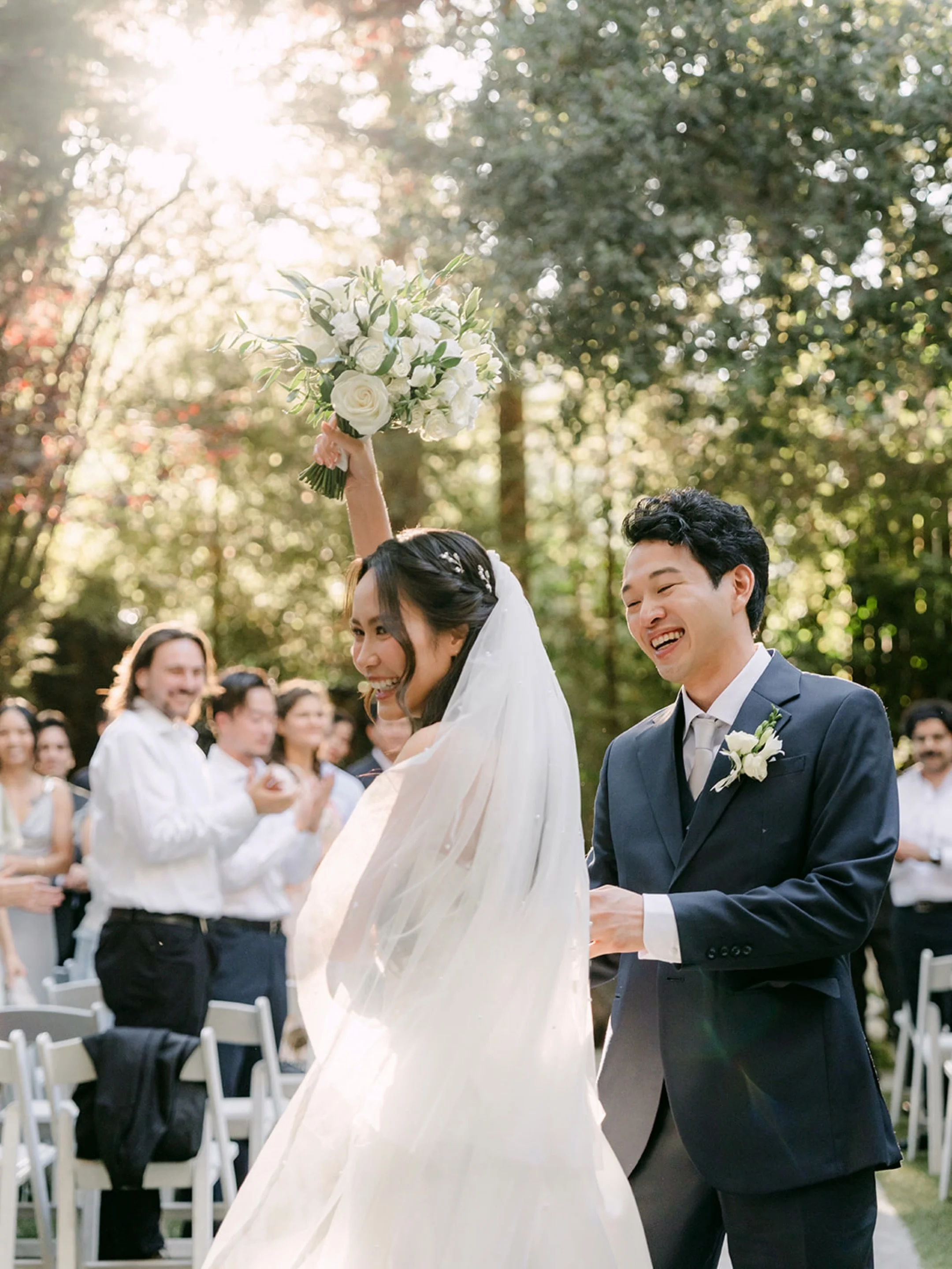 Tucked into the trees at @calamigosevents , Shogo &amp; Nhi exchanged vows surrounded by the people who know them best. From reading personal vows aloud to a dip-kiss recessional that had the whole aisle cheering, this ceremony had all the feeling.

