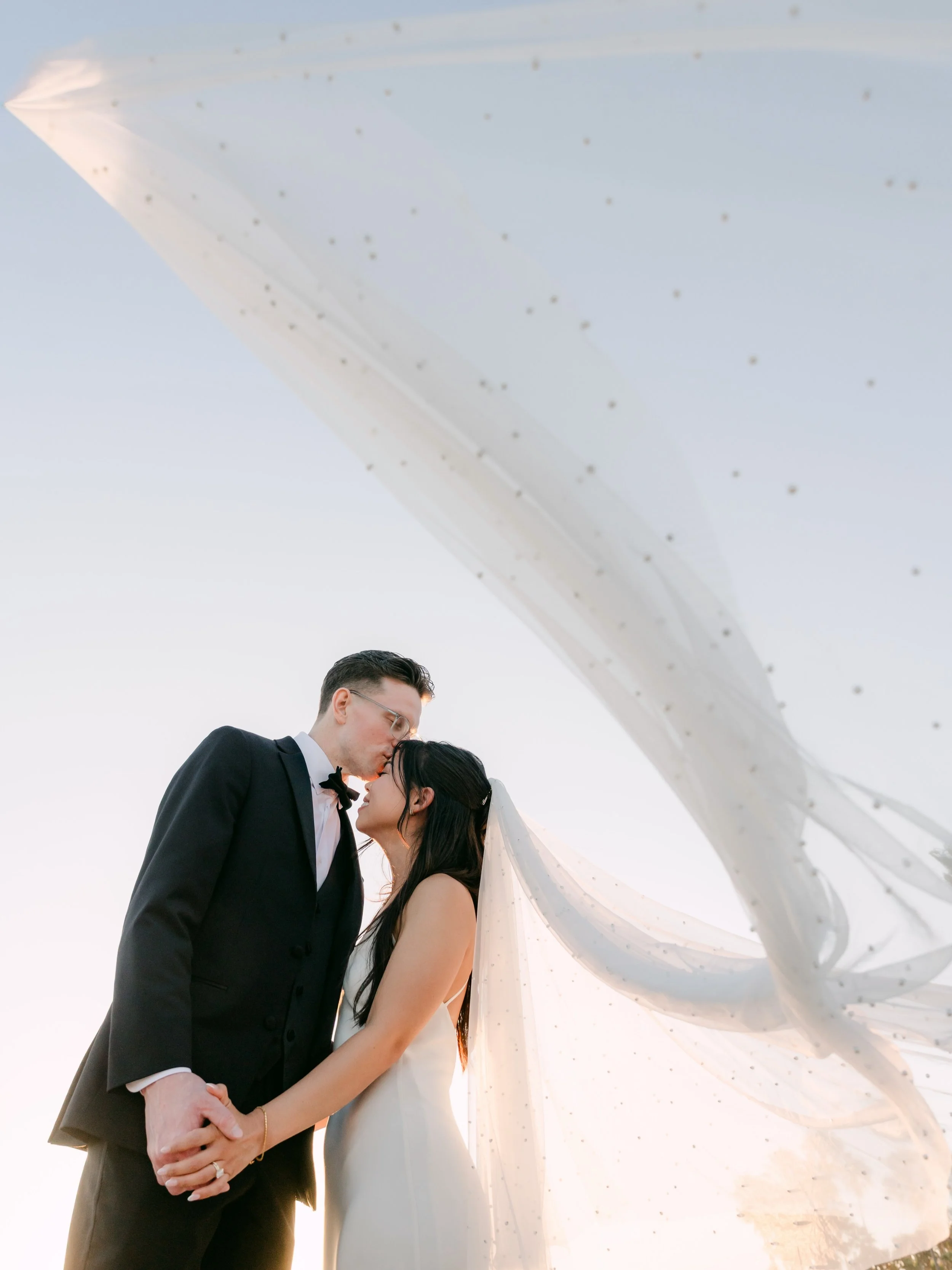 Veil and wind created a golden ratio in the sunset glow 🤍 Congratulations J&amp;M!
.
Planner @olivia.chui 
MUA @beautywithgracelee 
Florist @isaisafloral 
Bridal gown @grace_loves_lace 
DJ @redcarsounds 
Venue @figtreevenice 
.
#figtree #veniceweddi