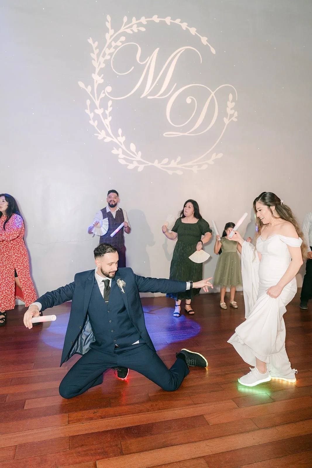 Danny dropping to his knees on the dance floor in front of Mariana