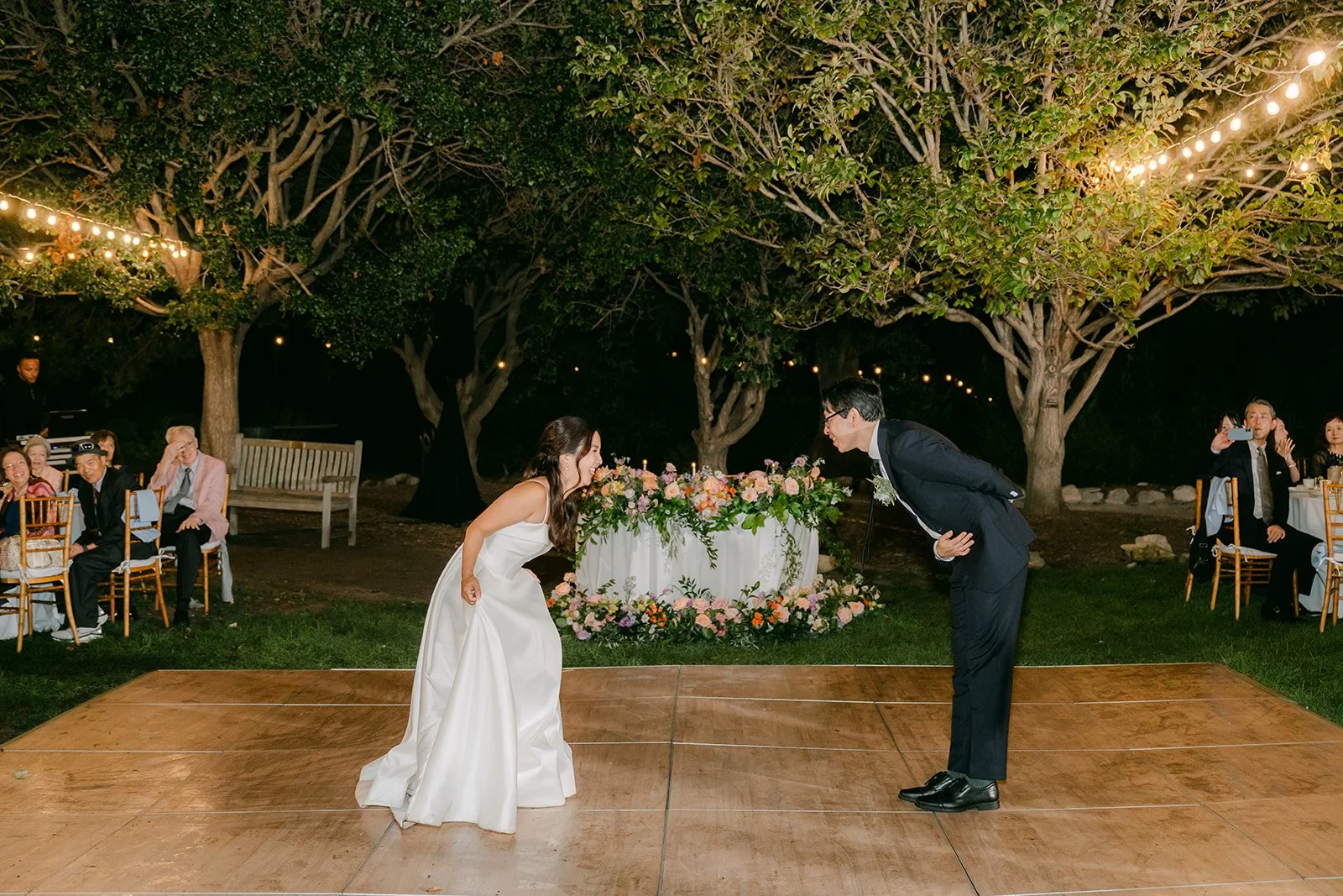 Saya and Leroy bowing to each other on the dance floor