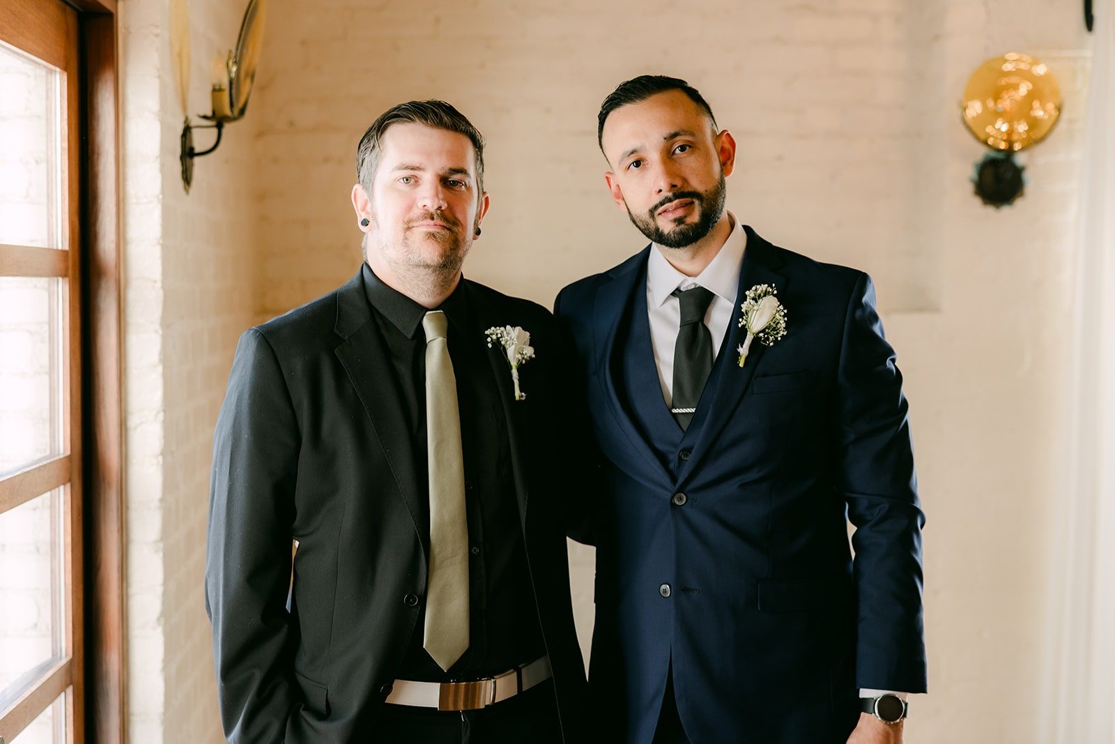 Danny standing with a friend in the groom's room