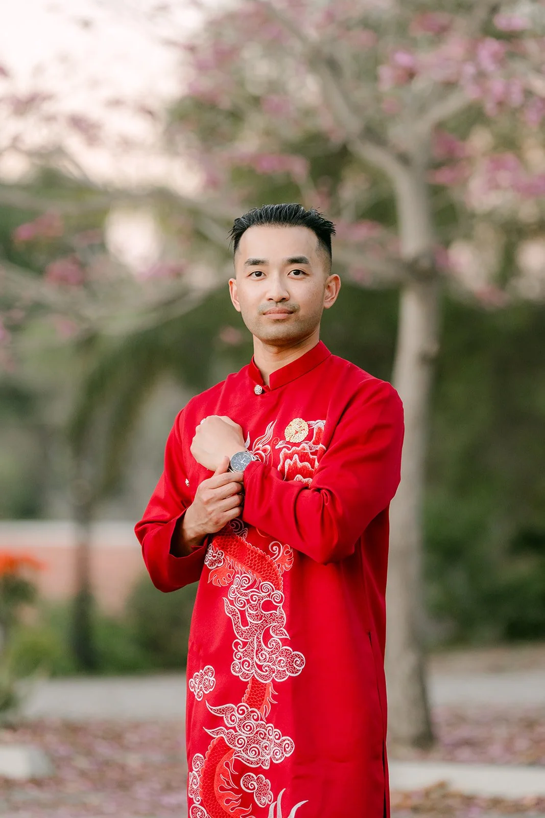 Vincent in his red ao dai, photographed by One and Only Production.