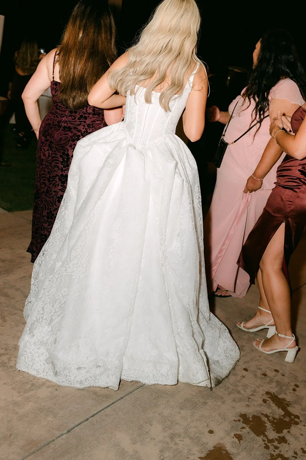 Konitha from behind, dancing with her friends