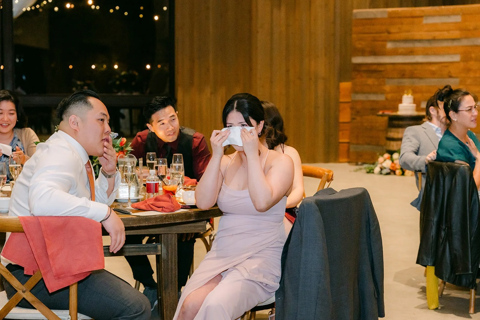 Guests laughing during the wedding speeches