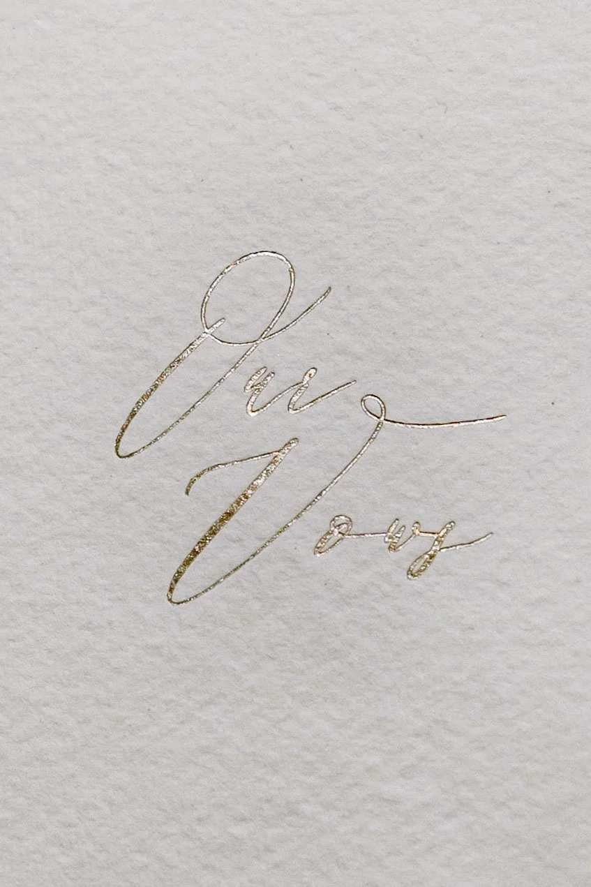 Calligraphy vow booklet on textured paper at Monserate Winery in Fallbrook