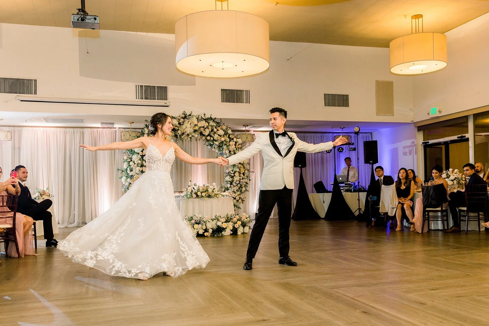 Wide view of the first dance in the reception room