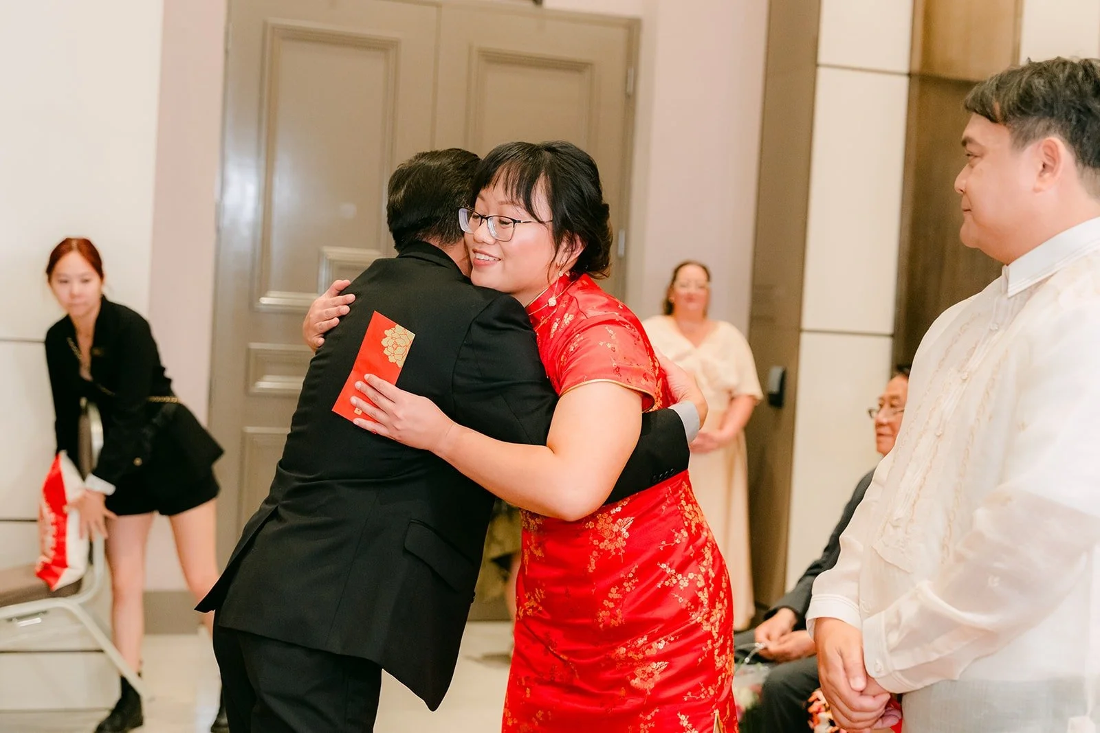 Stella sharing a hug with a guest during the tea ceremony
