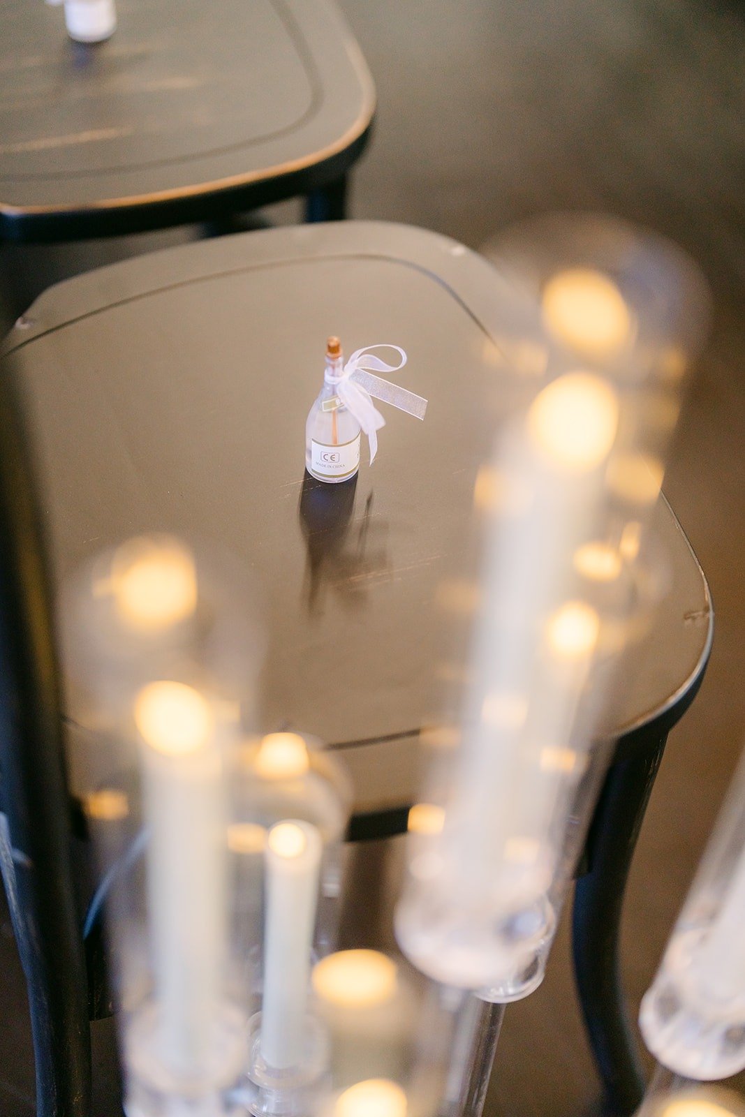 Pillar candles glowing along the aisle