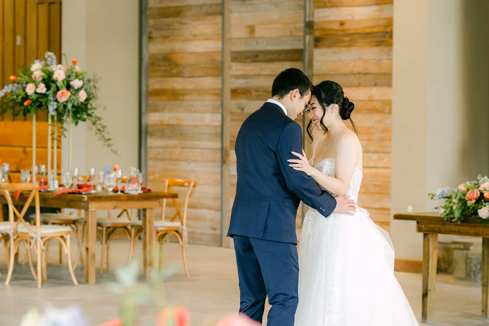 Yishan and Jonathan dancing beside the stone fireplace
