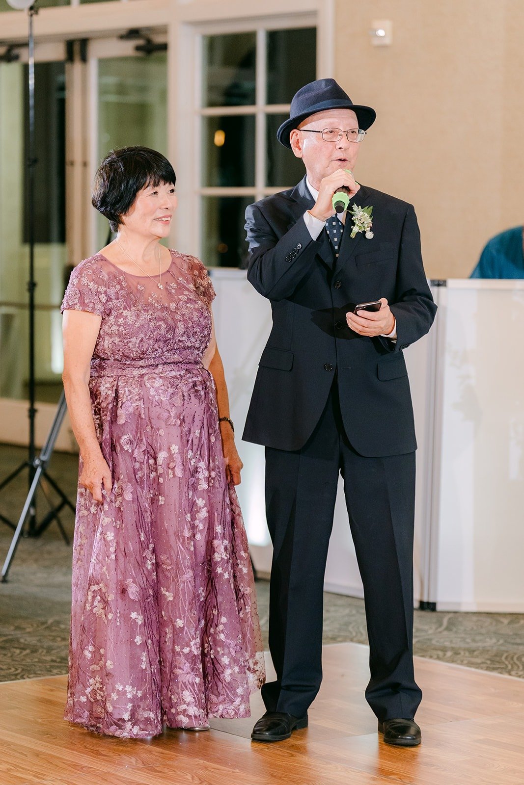Two guests giving a welcome speech at the reception