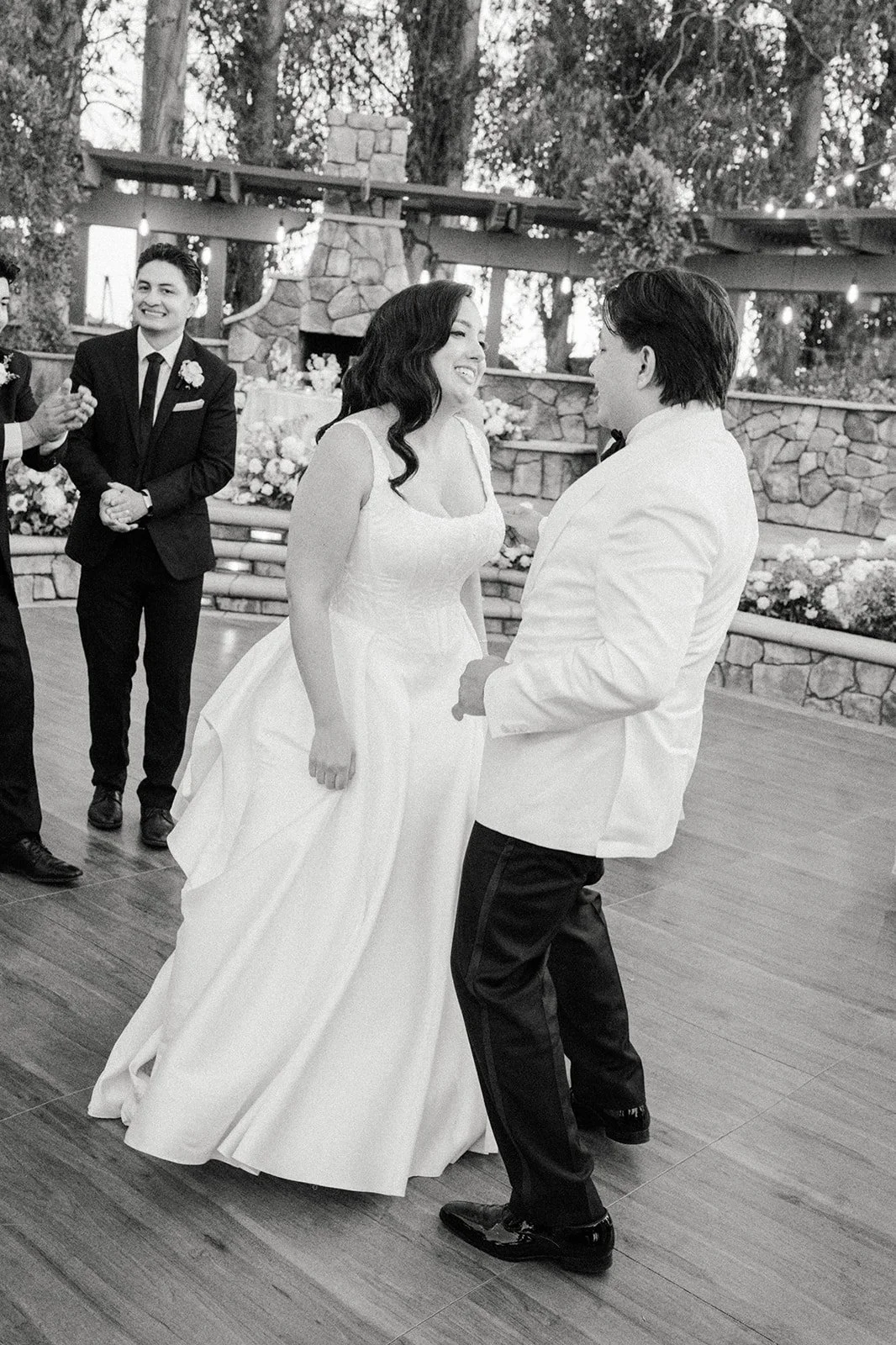 Black and white photo of the couple dancing in the reception