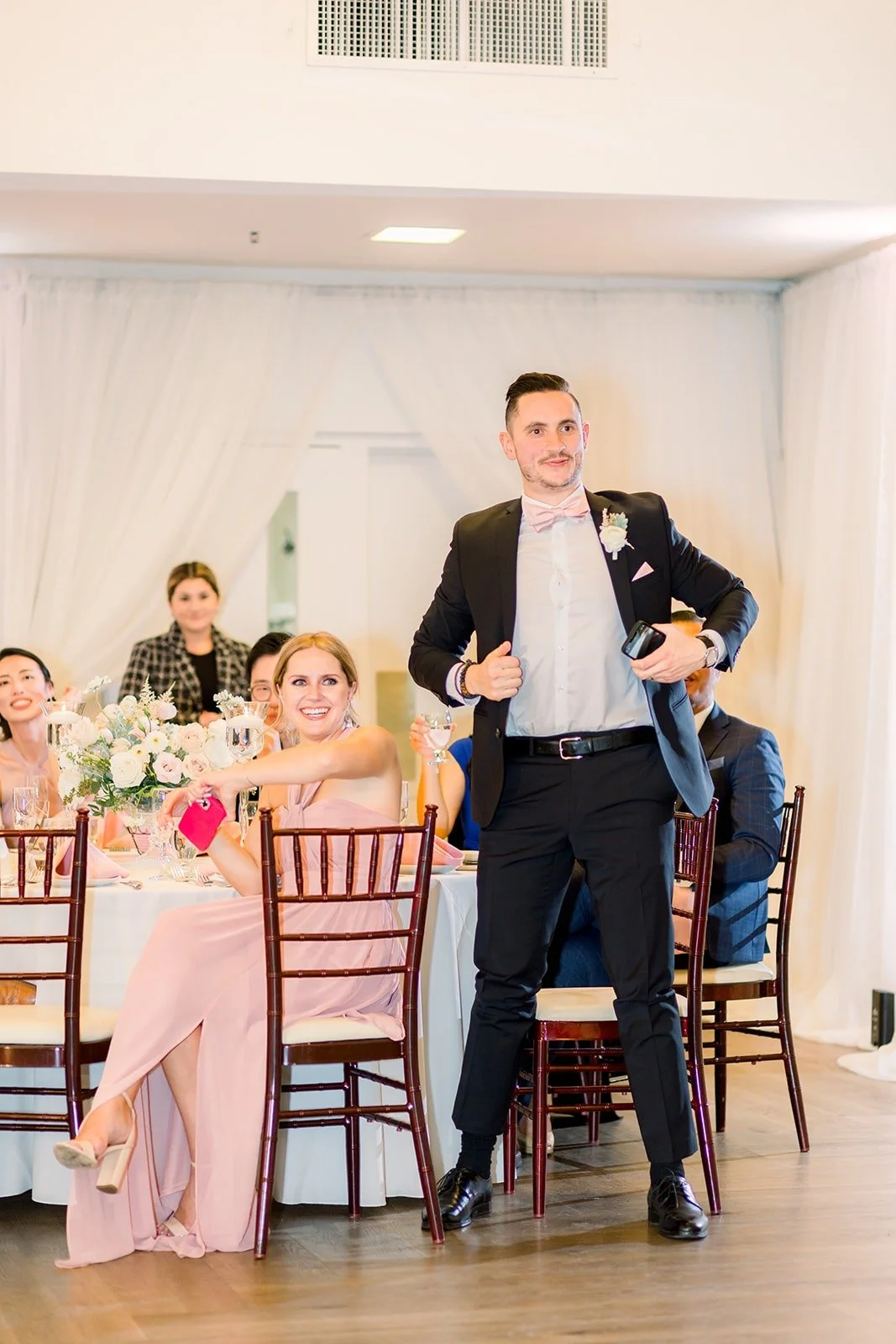 The magician standing on a chair during the show