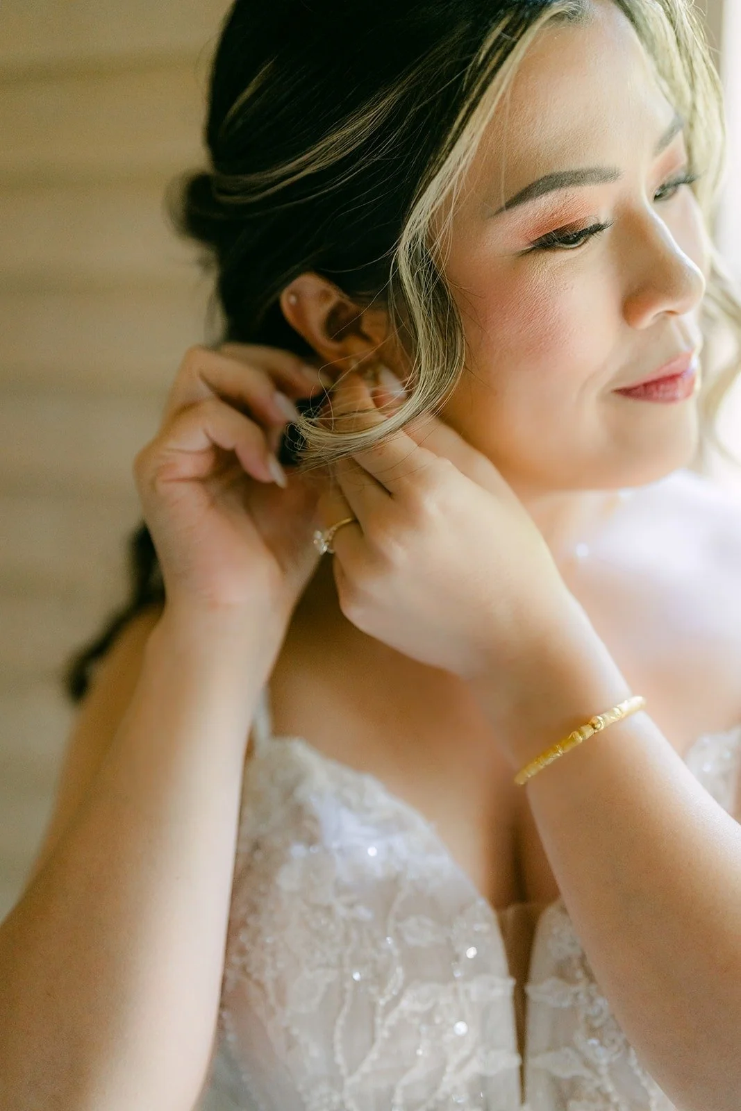 Joanne putting on her earrings in the suite at Rancho Bernardo Inn, photographed by One and Only Production